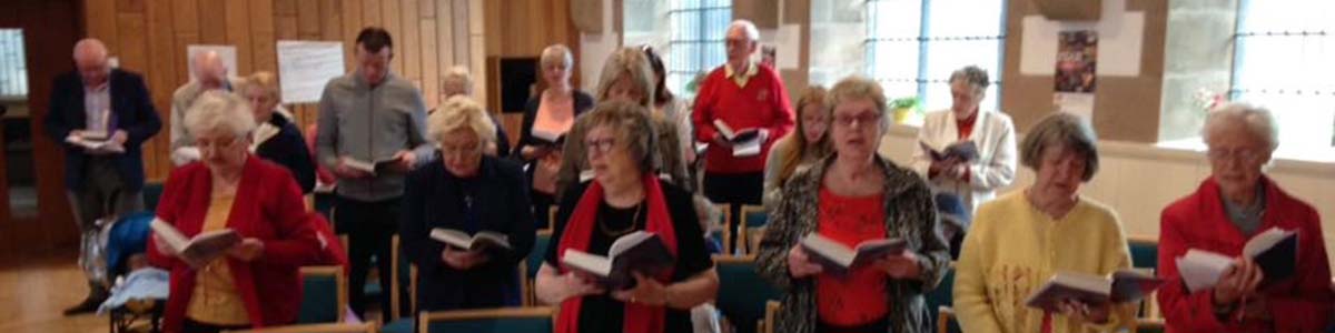 The congregation dressed in flame colours to remind us that we are Pentecost PeopleLong